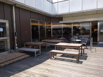 Table seats near the entrance of the 4F rooftop garden of Lumine Omiya 2
