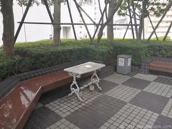 Table seats behind the Osaki New City Patio